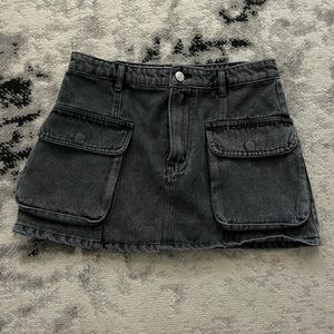 Black mini denim skirt with pockets